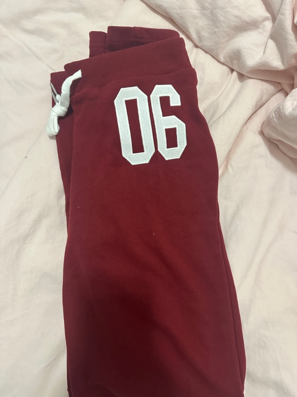 Edikted Maroon Sweatpants with White '06' Graphic